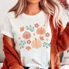 Pumpkin Leaves Collage Bella Graphic Tee sold by Roxie’s Picks