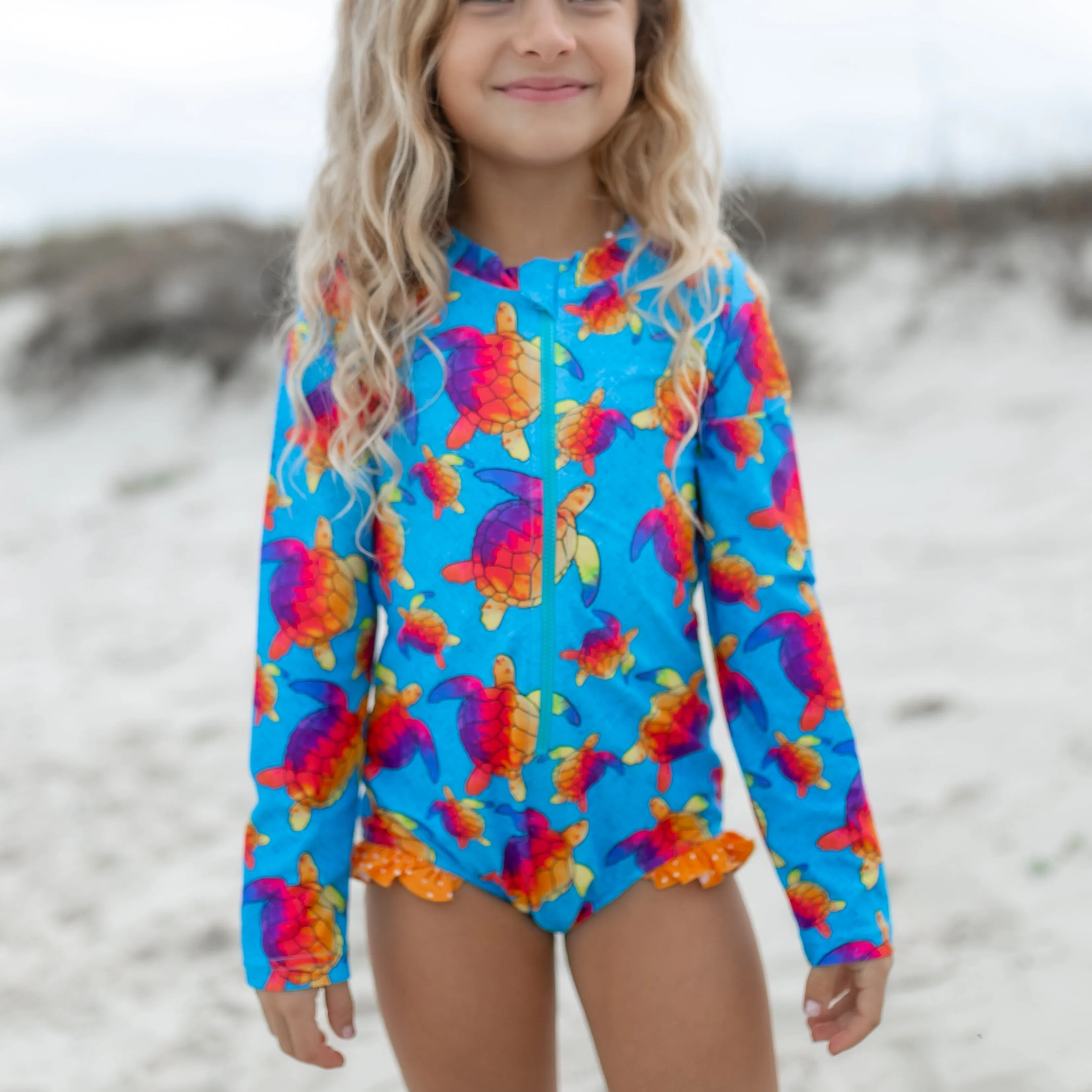 Mia Blue Rainbow Turtle Zip Swimsuit sold by Roxie’s Picks