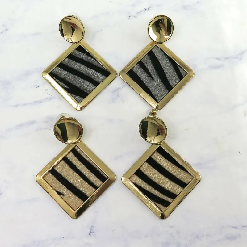 Gold Animal Print Dangle Earrings sold by Roxie’s Picks