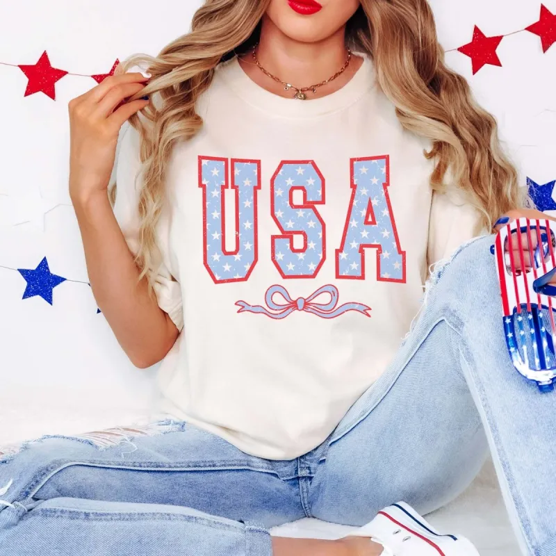 USA With Bow Comfort Color Tee sold by Roxie’s Picks