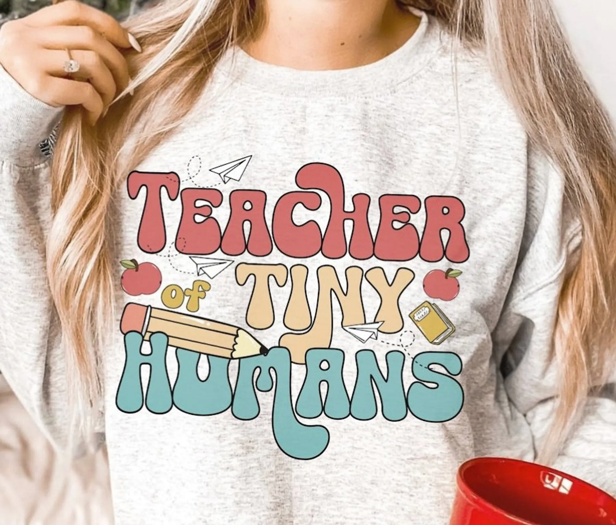 Teacher Of Tiny Humans T-Shirt or Crew Sweatshirt sold by Roxie’s Picks