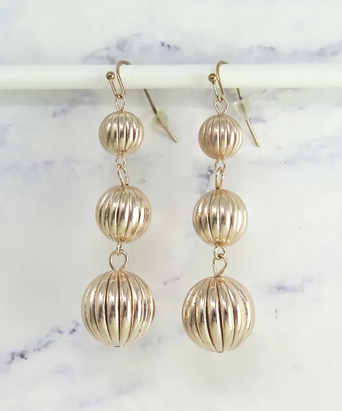 Rose Gold Textured Triple Ball Dangle Earrings sold by Roxie’s Picks