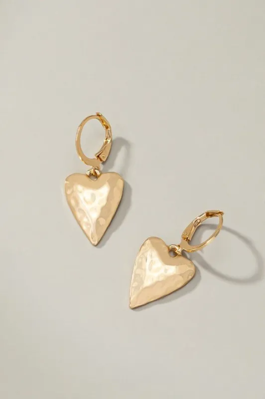Hammered heart drop on a huggie hoop earrings sold by Roxie’s Picks