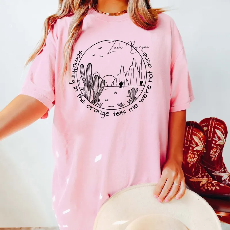 Something In The Orange Circle Comfort Color Tee sold by Roxie’s Picks