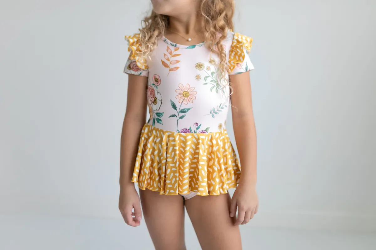 Mustard Dot Floral Skirted Leotard sold by Roxie’s Picks