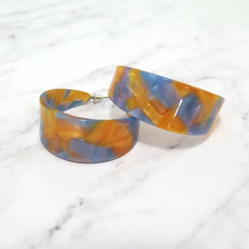 Lucite Orange and Blue Marble Hoop Earrings sold by Roxie’s Picks
