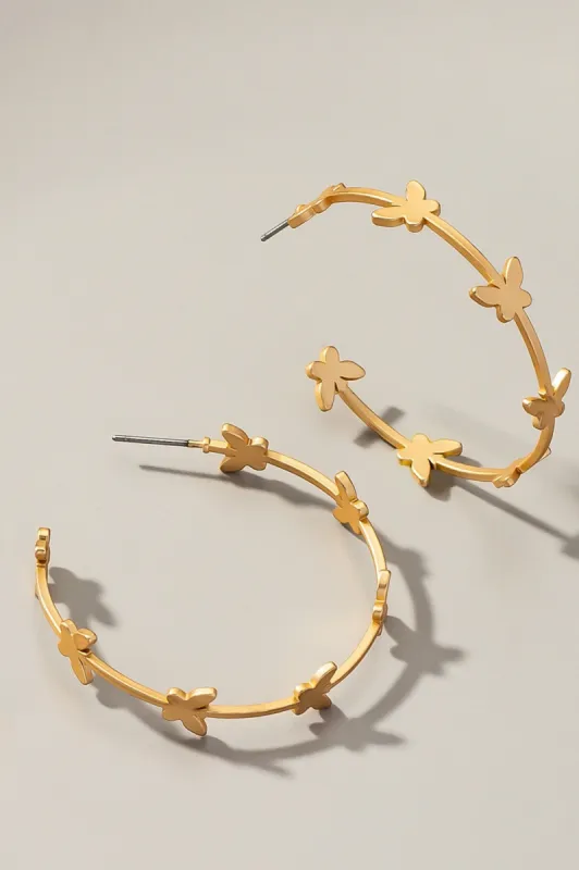 Butterfly stationed hoop earrings sold by Roxie’s Picks