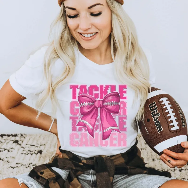Tackle Cancer Football Bow Bella Graphic Tee sold by Roxie’s Picks