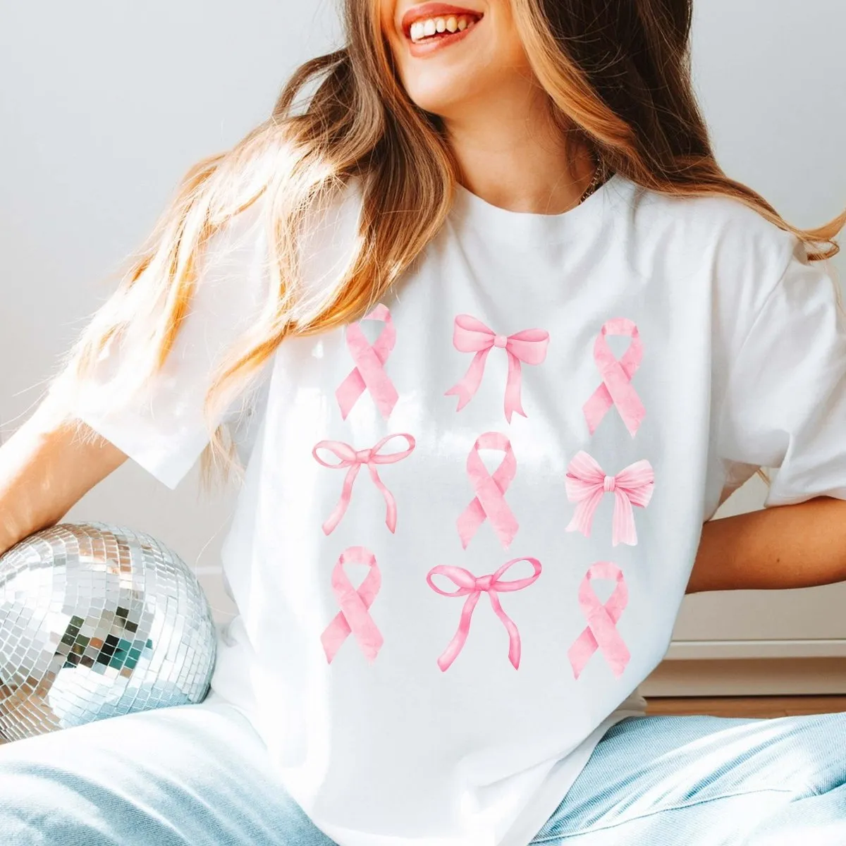 Breast Cancer Awareness Bow Ribbon Collage Bella Graphic Tee sold by Roxie’s Picks