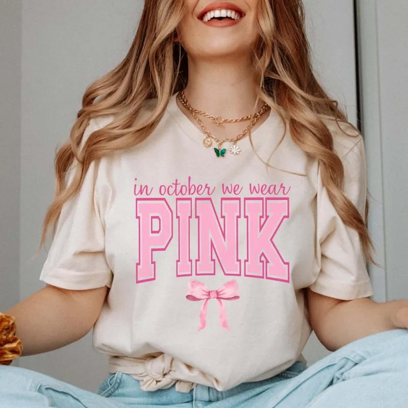 In October We Wear Pink Bow Bella Graphic Tee sold by Roxie’s Picks