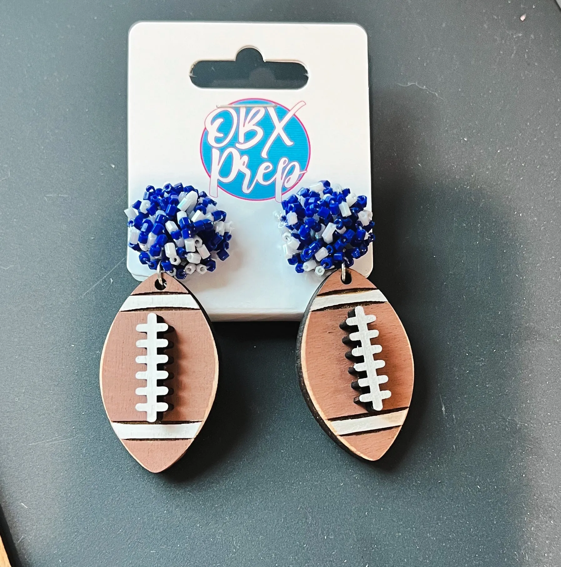 Custom Team Spirit Bead Topped Hand Painted Football Dangle Earrings sold by Roxie’s Picks
