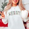 Plaid Merry Graphic Sweatshirt sold by Roxie’s Picks