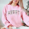 Plaid Merry Graphic Sweatshirt sold by Roxie’s Picks