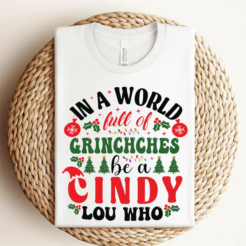 In A World Of Grinches Be A Cindy Lou Who Christmas Graphic Tee sold by Roxie’s Picks
