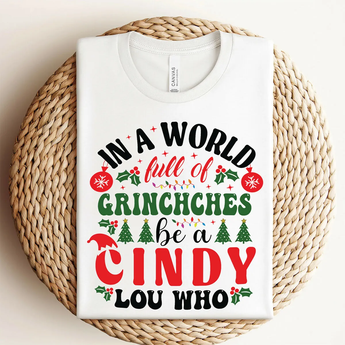 In A World Of Grinches Be A Cindy Lou Who Christmas Graphic Tee sold by Roxie’s Picks