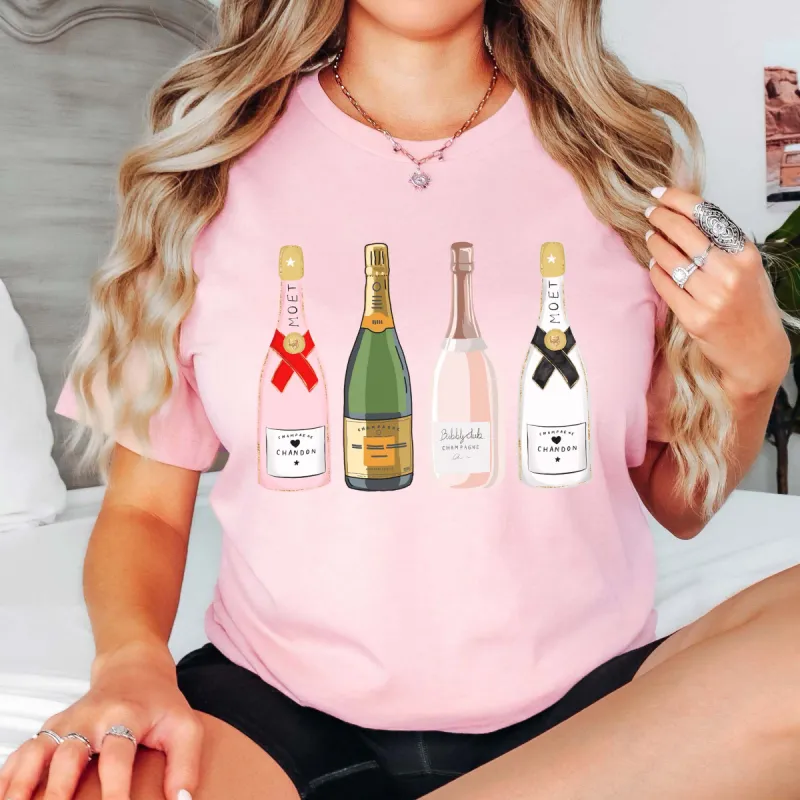 Festive Champagne Bottles Bella Graphic Tee sold by Roxie’s Picks