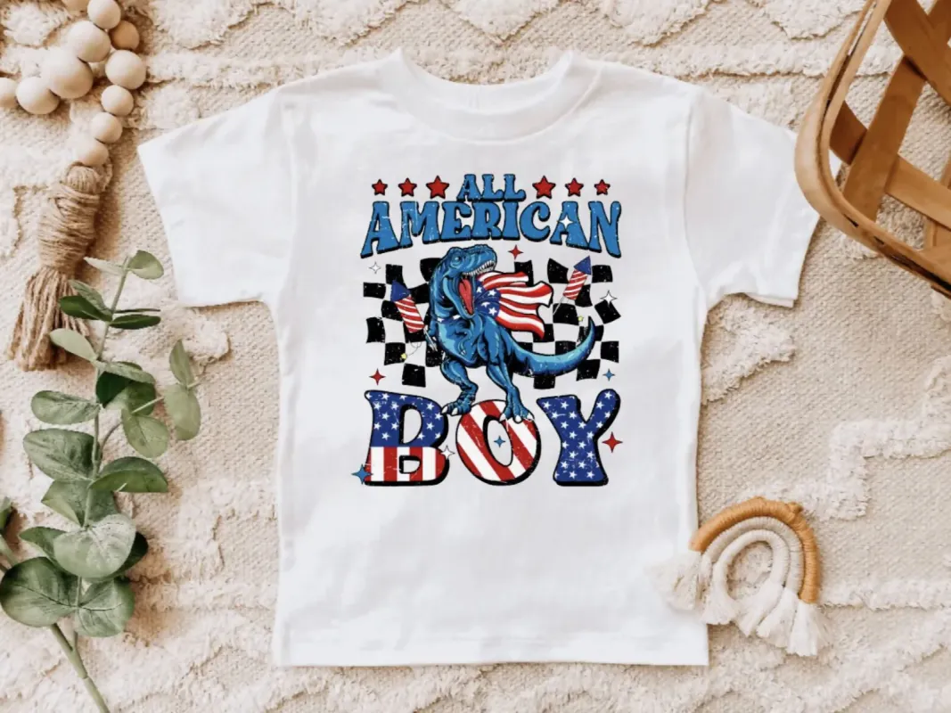 All American Boy Dinosaur 4th of July Tee Shirt sold by Roxie’s Picks