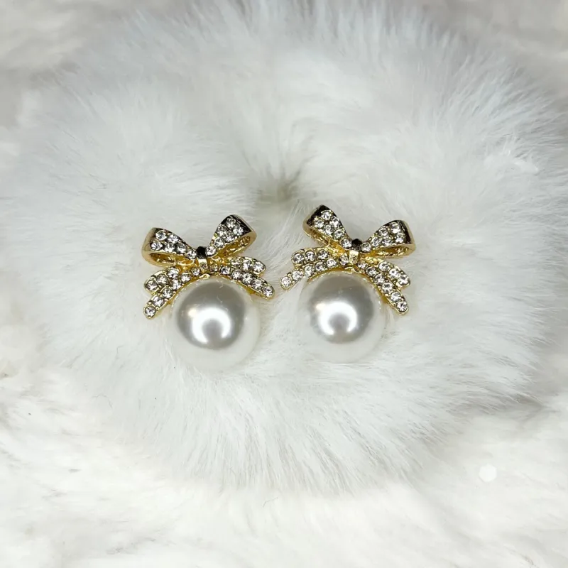 Sparkling Bow & Pearl Stud Earrings sold by Roxie’s Picks