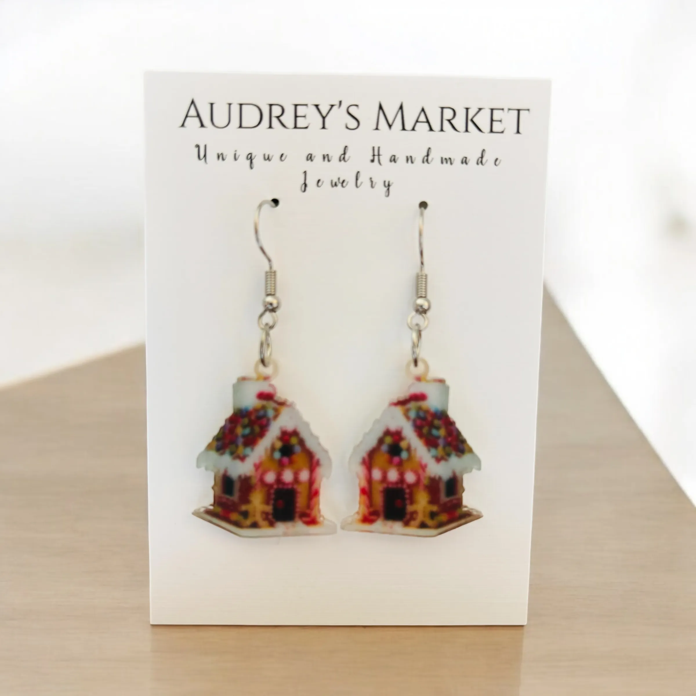 Whimsical Gingerbread House Christmas Dangle Earrings sold by Roxie’s Picks