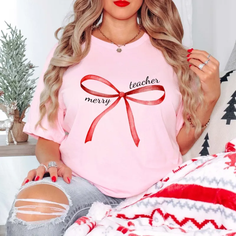 Merry Teacher Red Bow Bella Graphic Tee sold by Roxie’s Picks