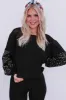 Black Sequin Top sold by Roxie’s Picks
