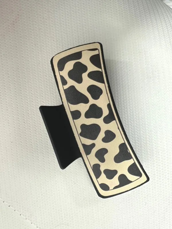 Cream Animal Print Hair Claw sold by Roxie’s Picks