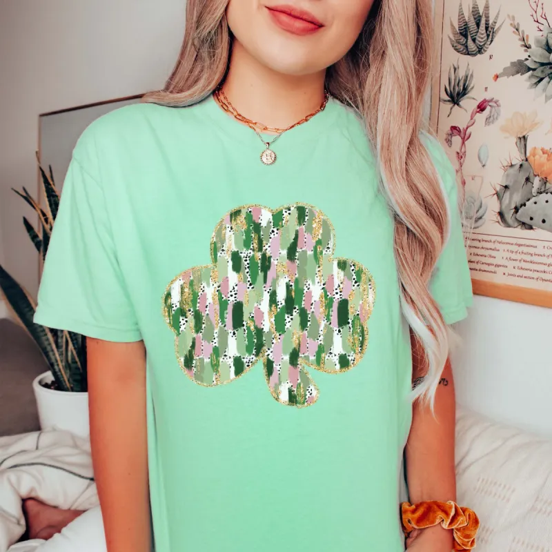 Brush Stroke Shamrock Comfort Color Tee sold by Roxie’s Picks