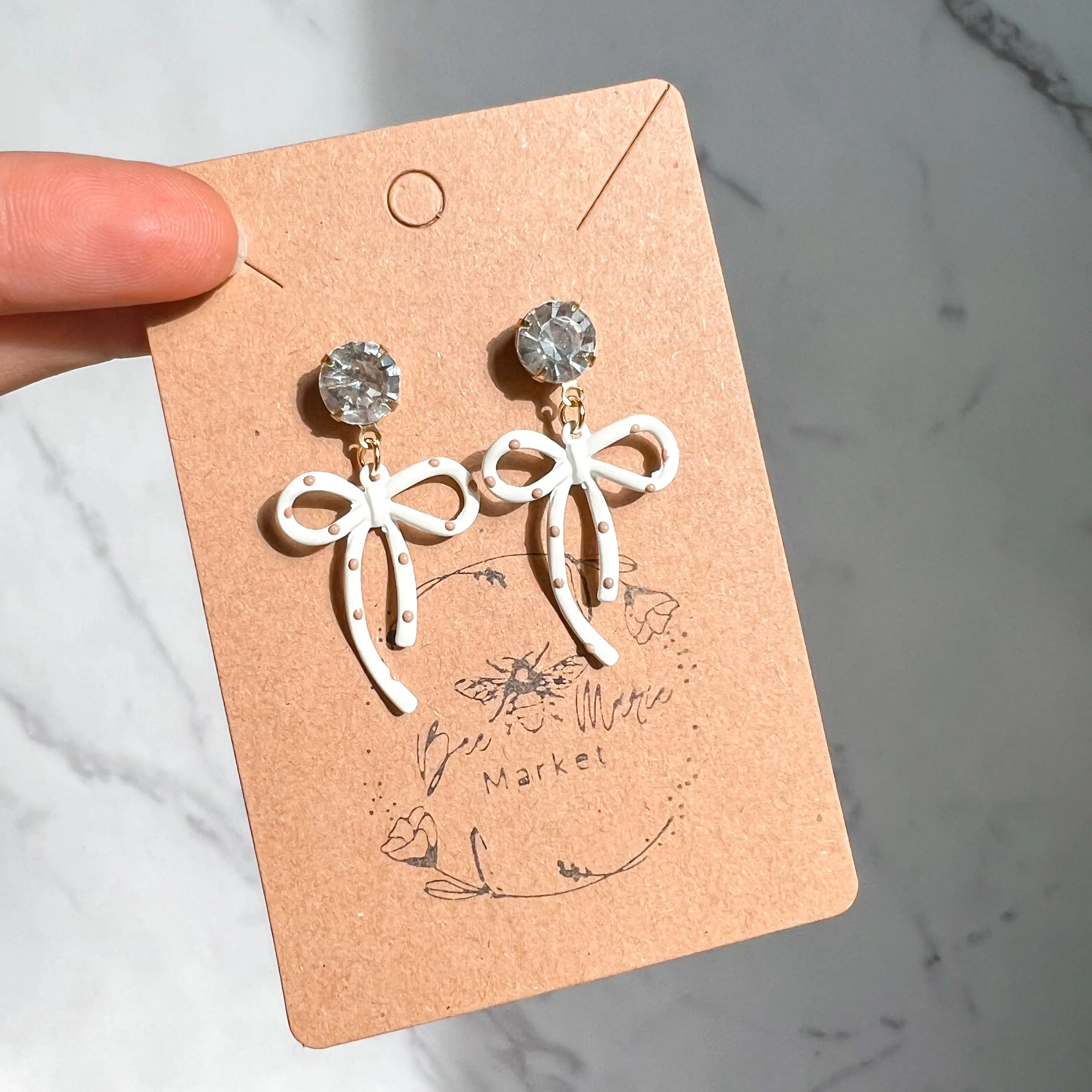 Darla White & Tan Polka Dot Diamond Earrings sold by Roxie’s Picks