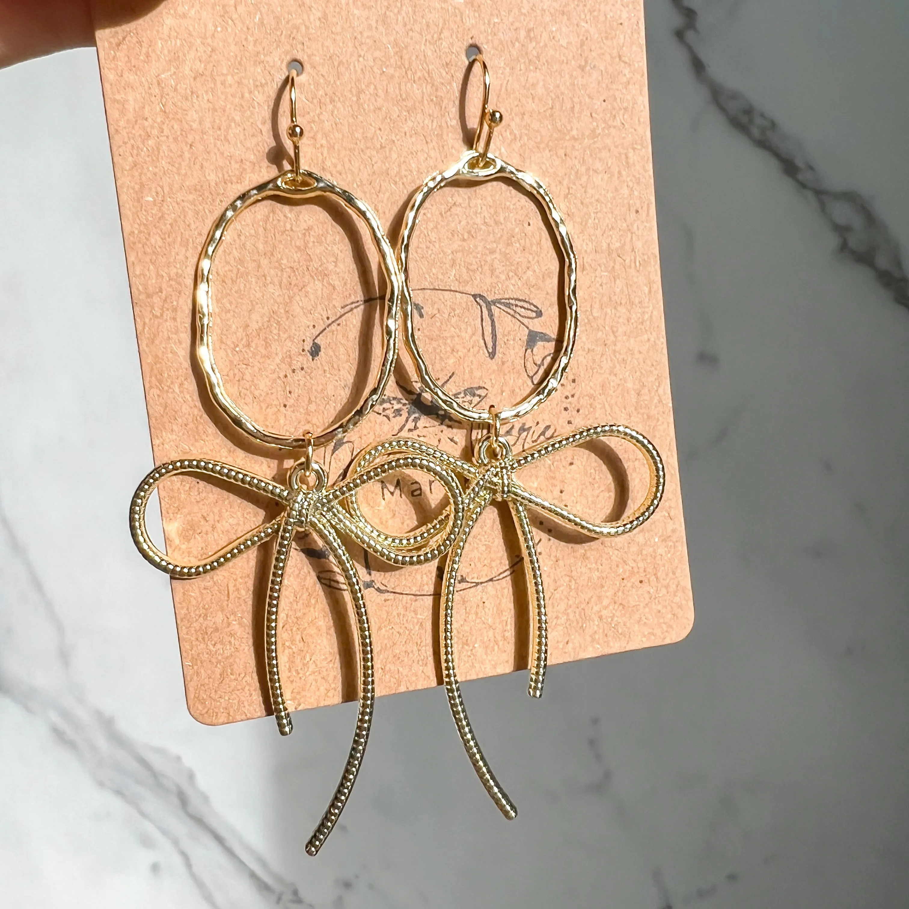 Erica Gold Bow Hoop Earrings sold by Roxie’s Picks product image thumbnail 4
