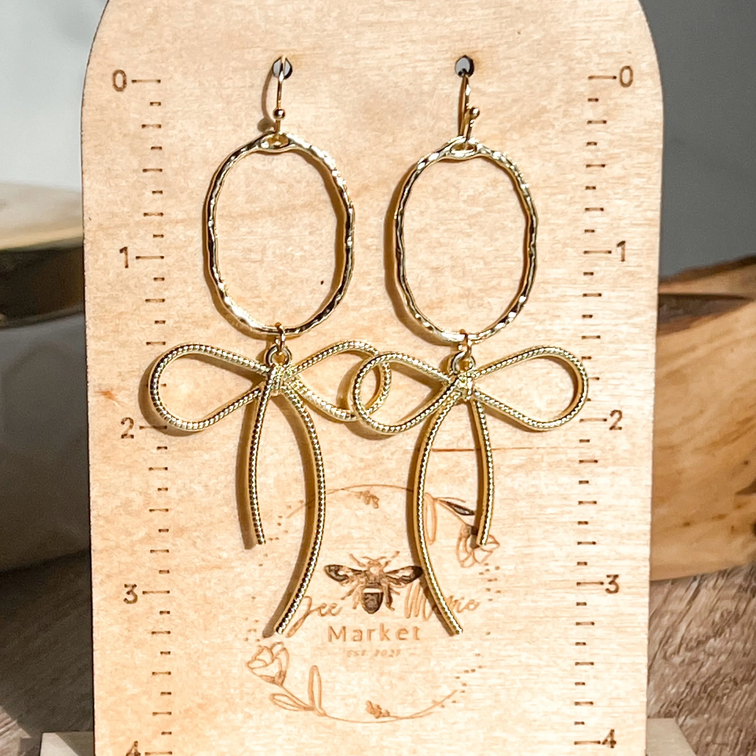 Erica Gold Bow Hoop Earrings sold by Roxie’s Picks