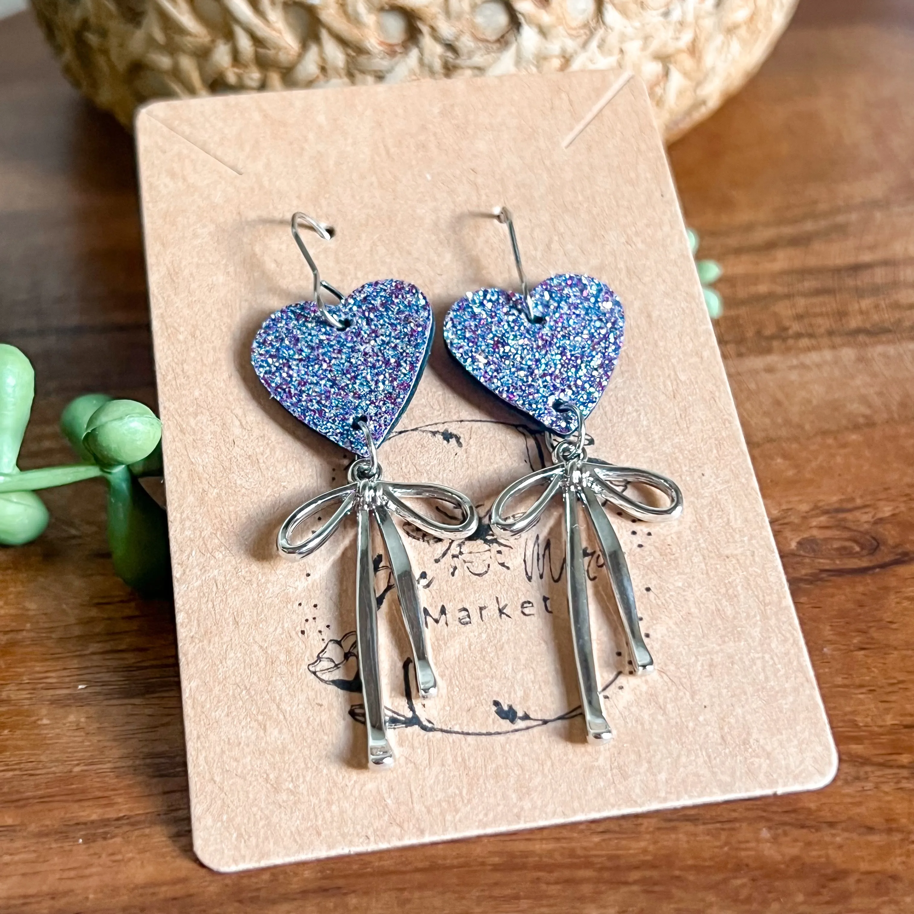 Lauren Lavender Glitter Heart & Silver Bow Earrings sold by Roxie’s Picks