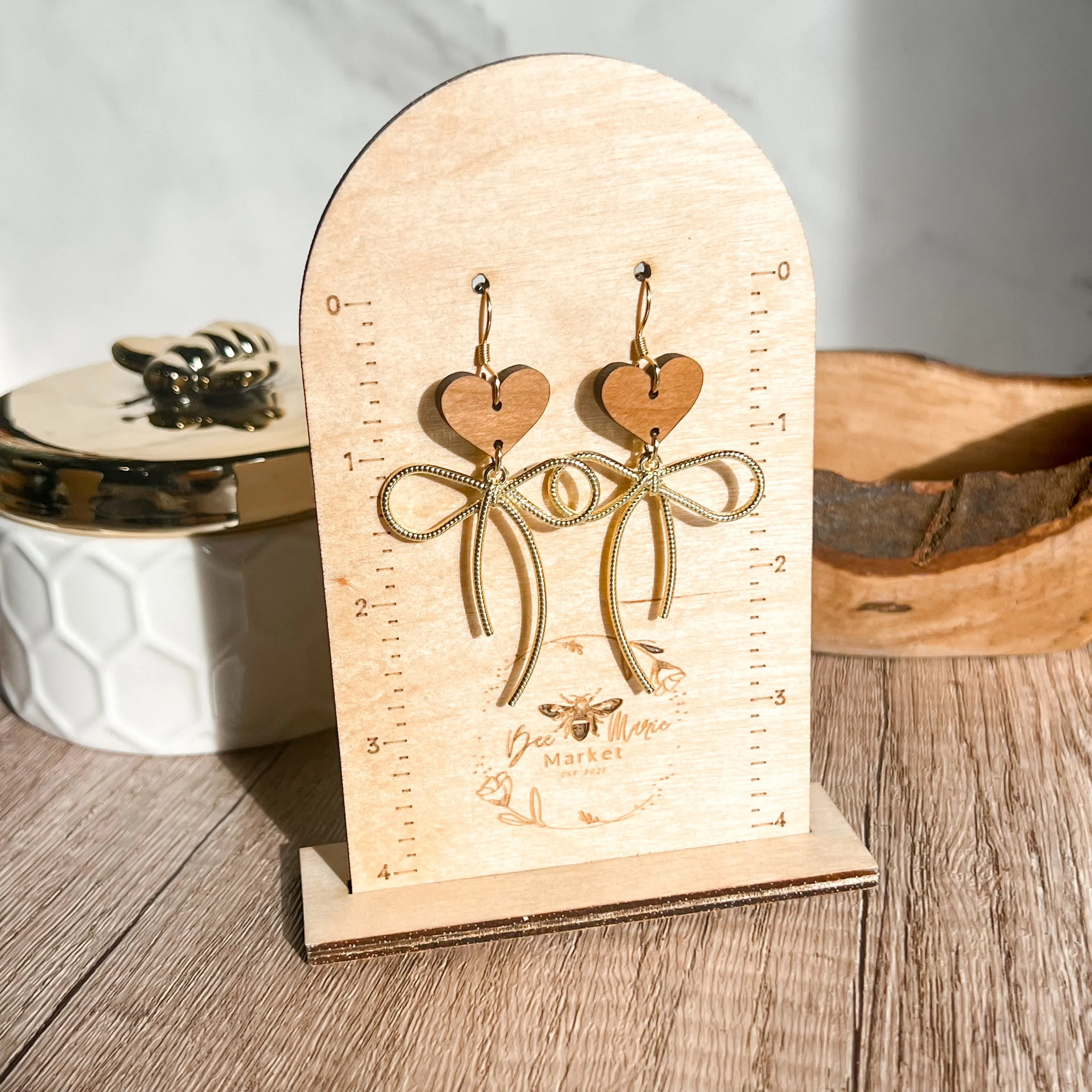 Erica Gold Bow Heart Earrings sold by Roxie’s Picks