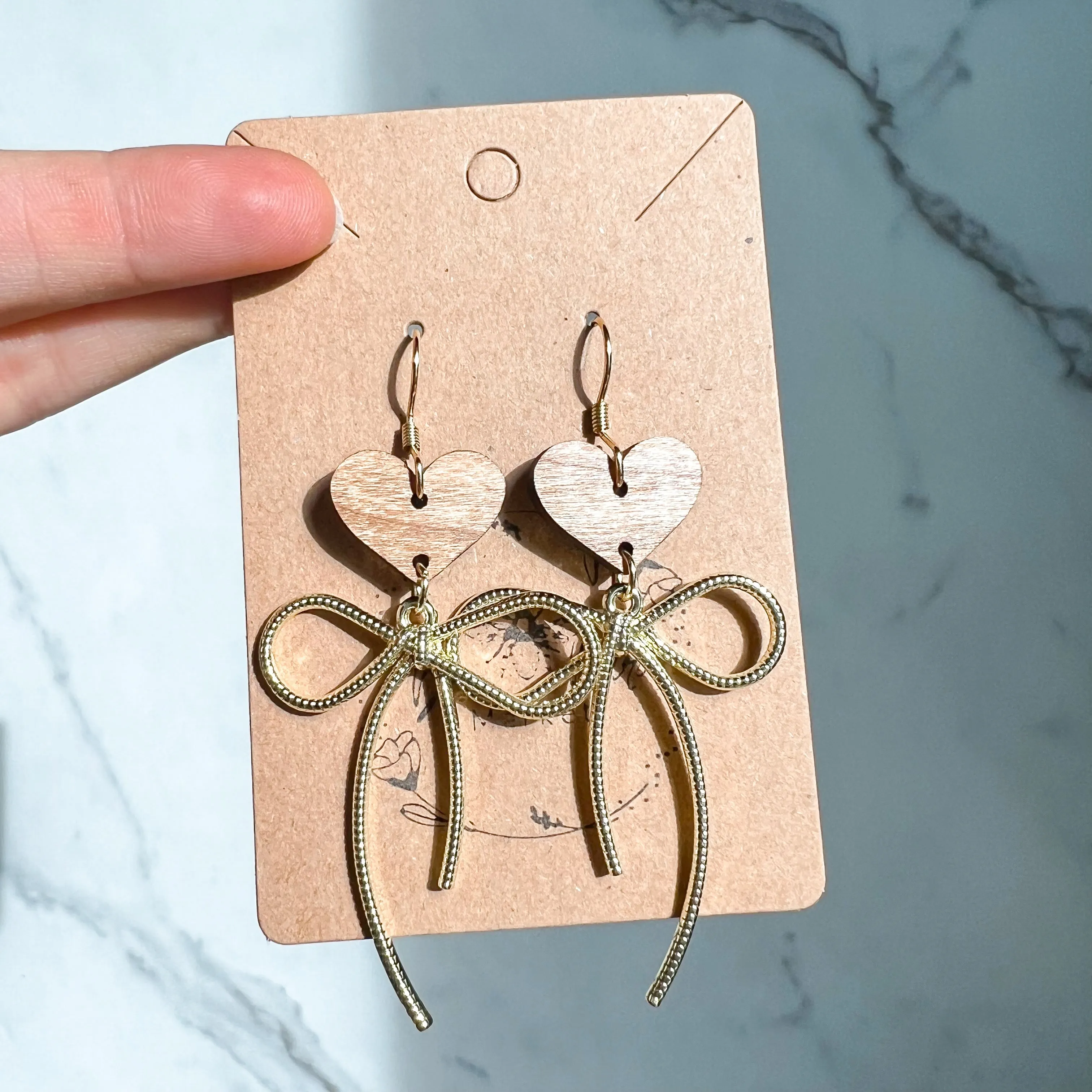 Erica Gold Bow Heart Earrings sold by Roxie’s Picks product image thumbnail 3