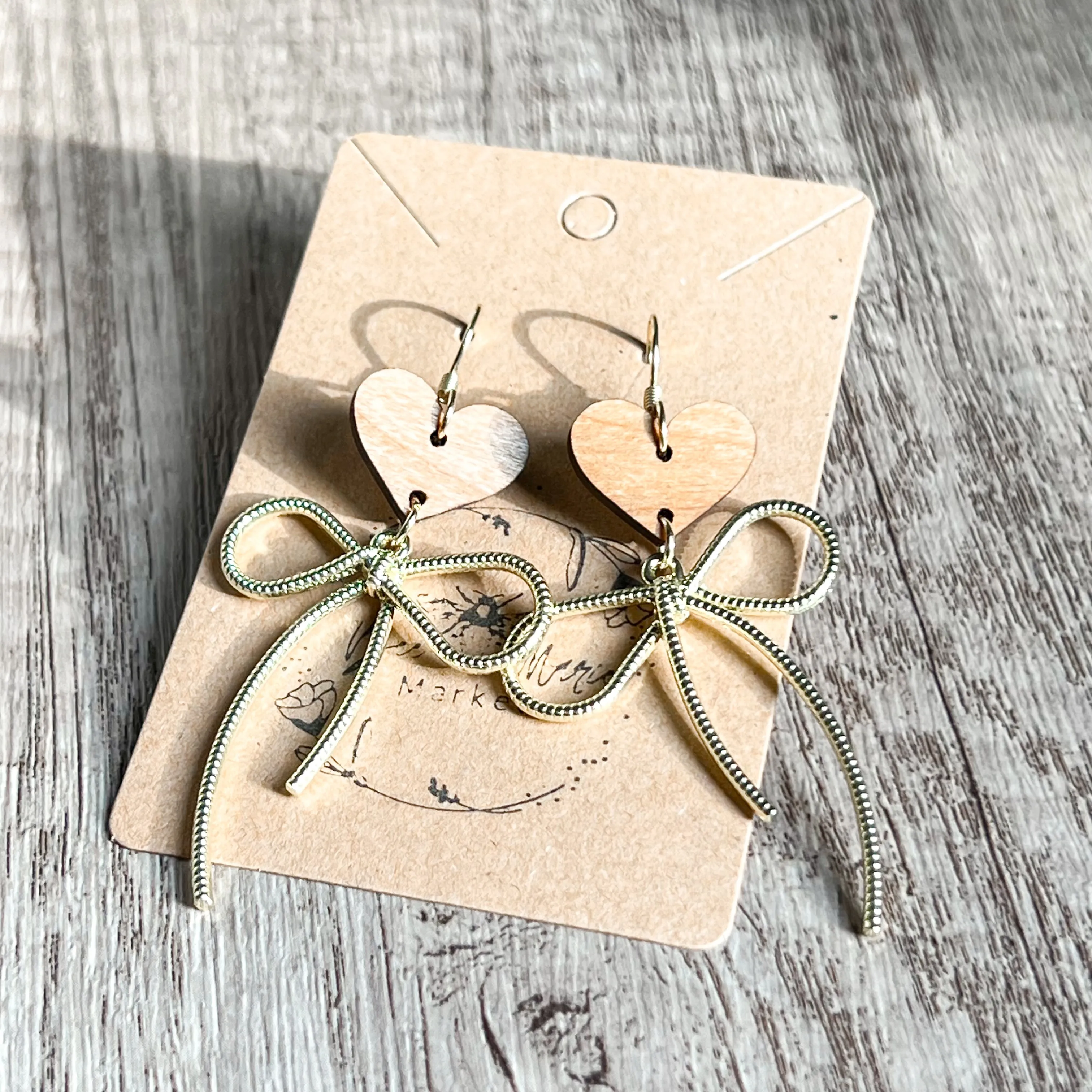 Erica Gold Bow Heart Earrings sold by Roxie’s Picks product image thumbnail 4