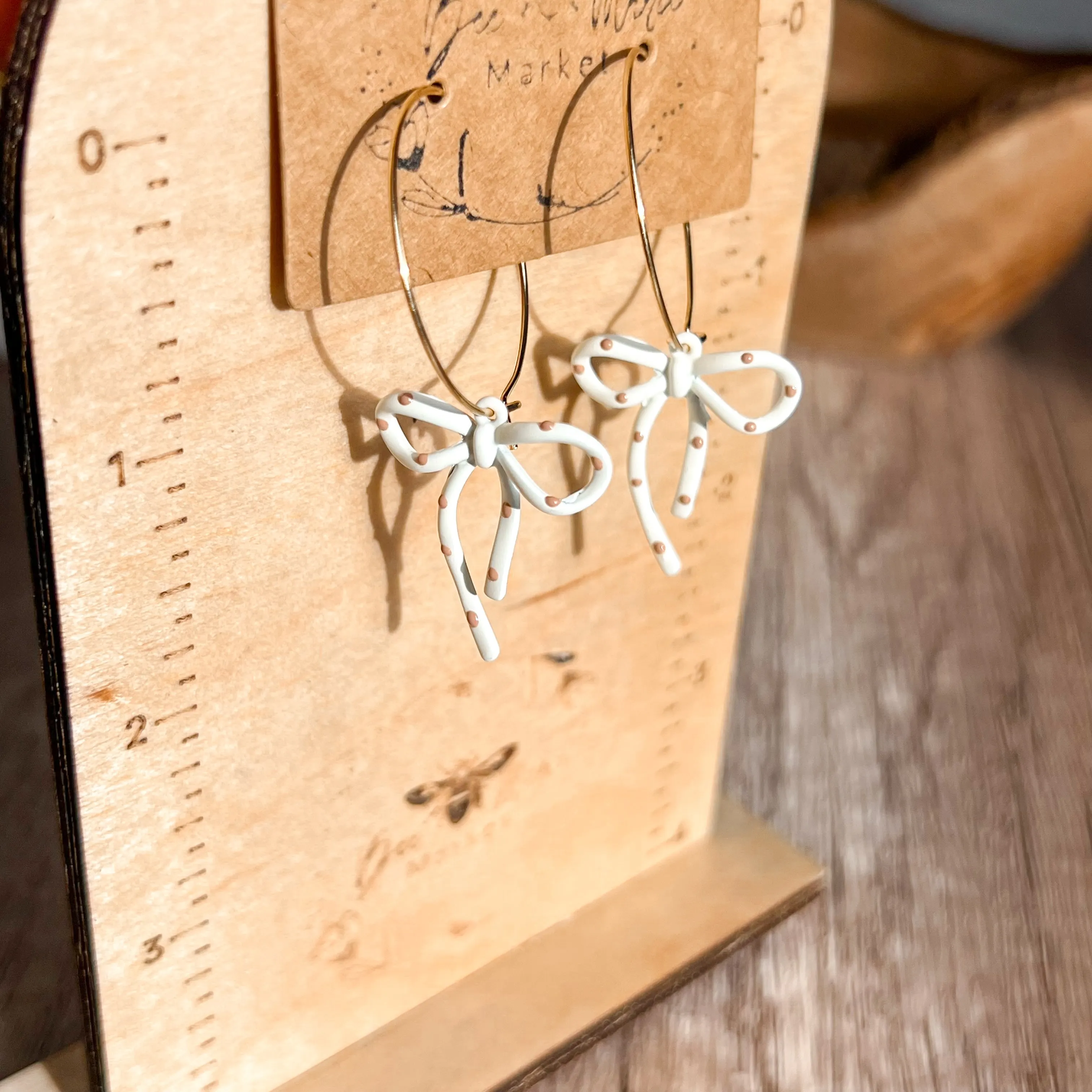 Darla White & Tan Polka Dot Hoop Earrings sold by Roxie’s Picks product image thumbnail 3