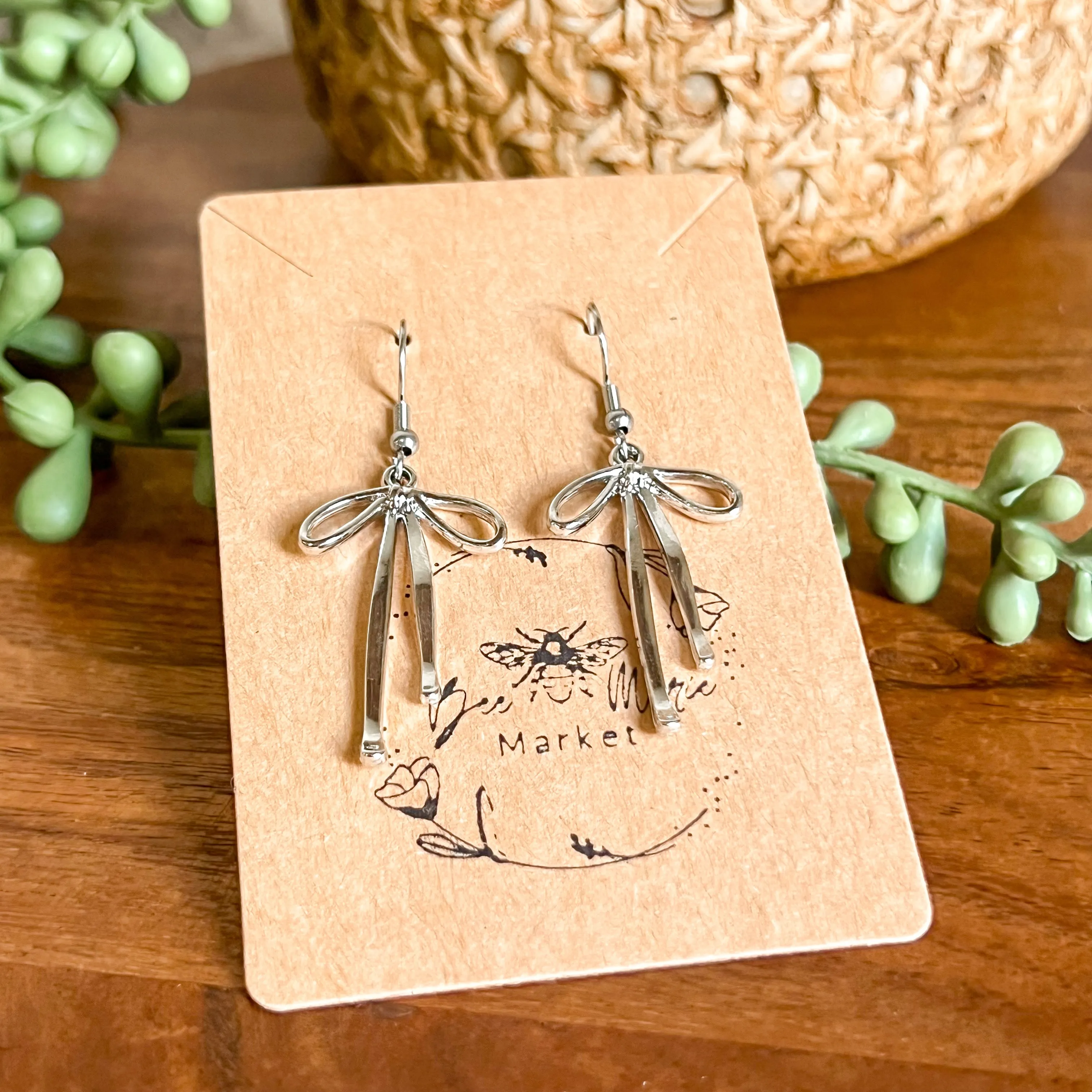 Dana Silver Bow Earrings sold by Roxie’s Picks