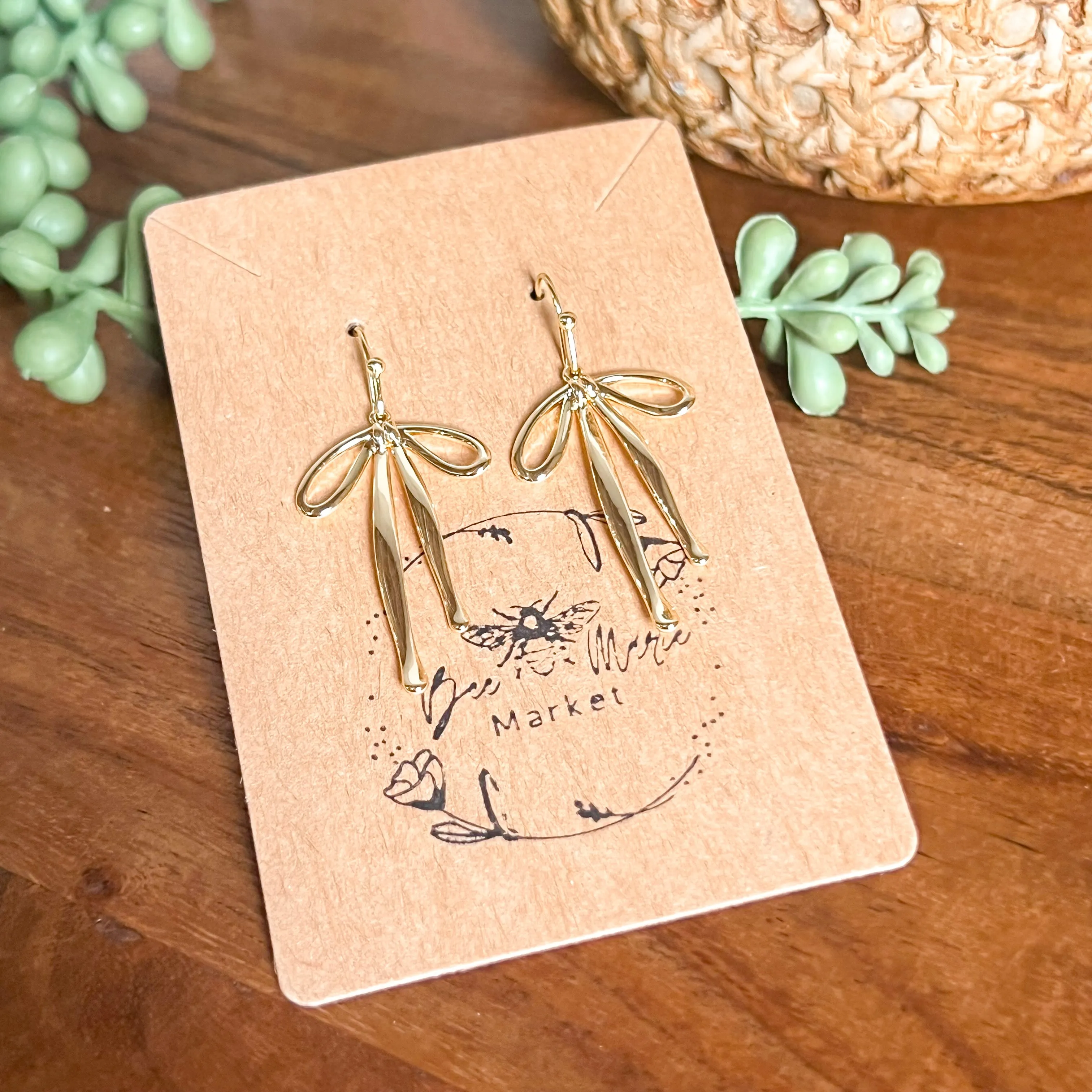 Dana Gold Bow Earrings sold by Roxie’s Picks