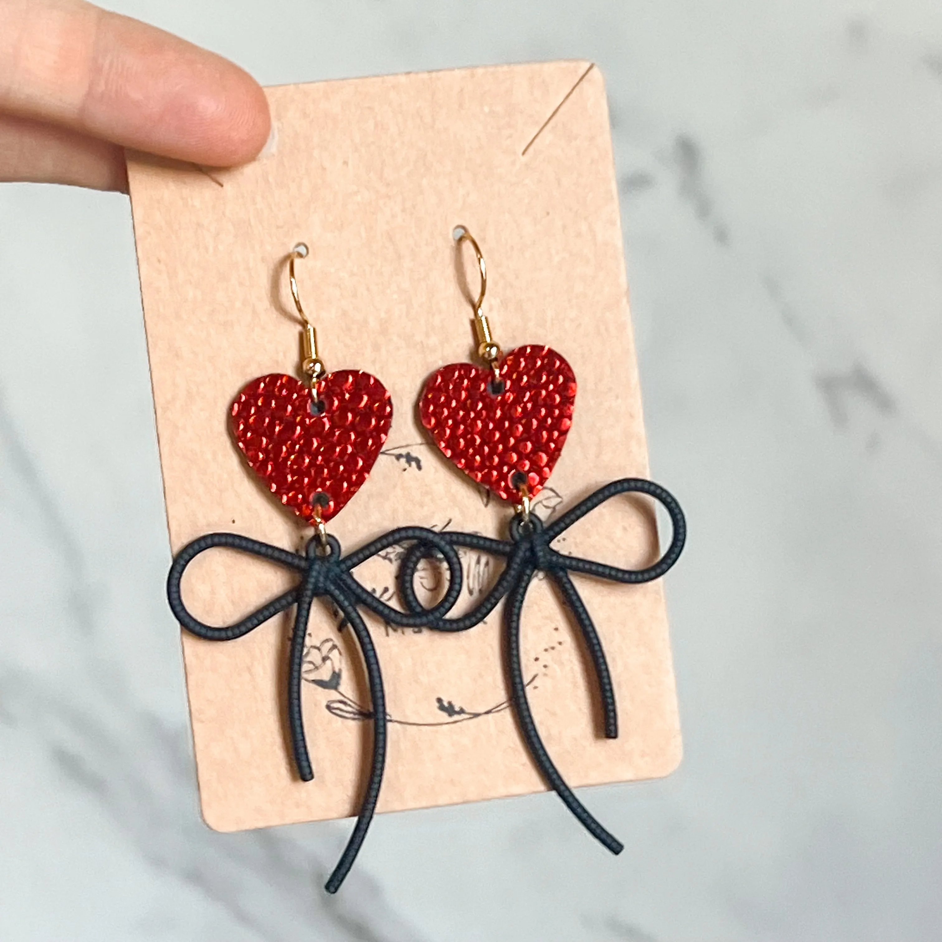 Ruby Red Pebbled Heart & Bow Earrings sold by Roxie’s Picks product image thumbnail 3