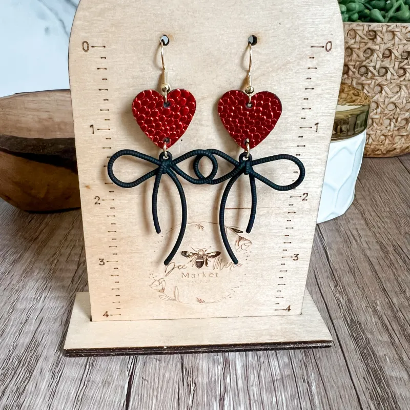 Ruby Red Pebbled Heart & Bow Earrings sold by Roxie’s Picks