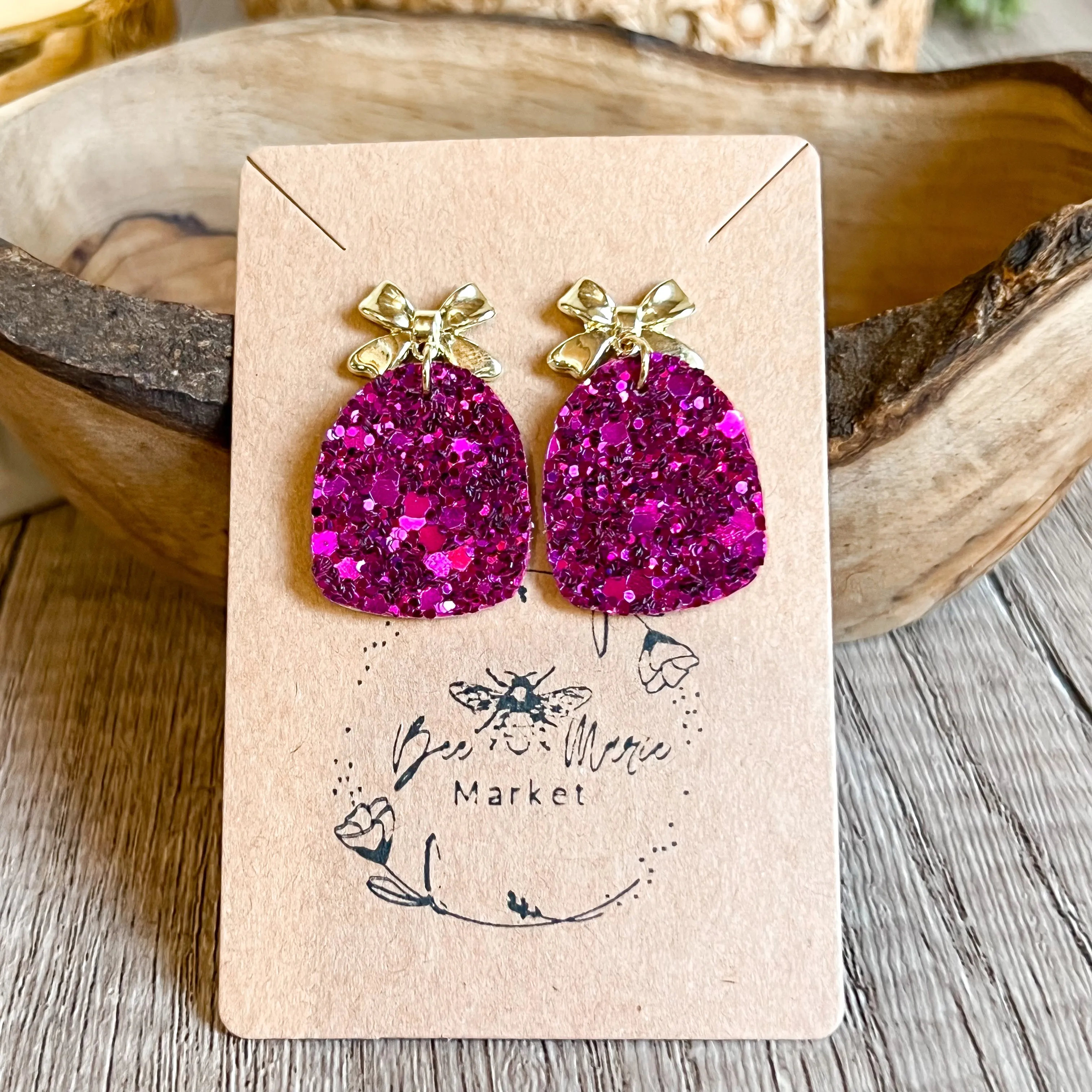 Jessie Raspberry Glitter Arch Bow Earrings sold by Roxie’s Picks