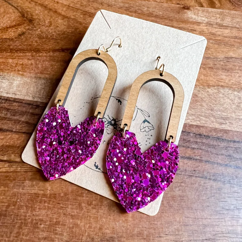 Gina Raspberry Glitter Heart Arch Earrings sold by Roxie’s Picks