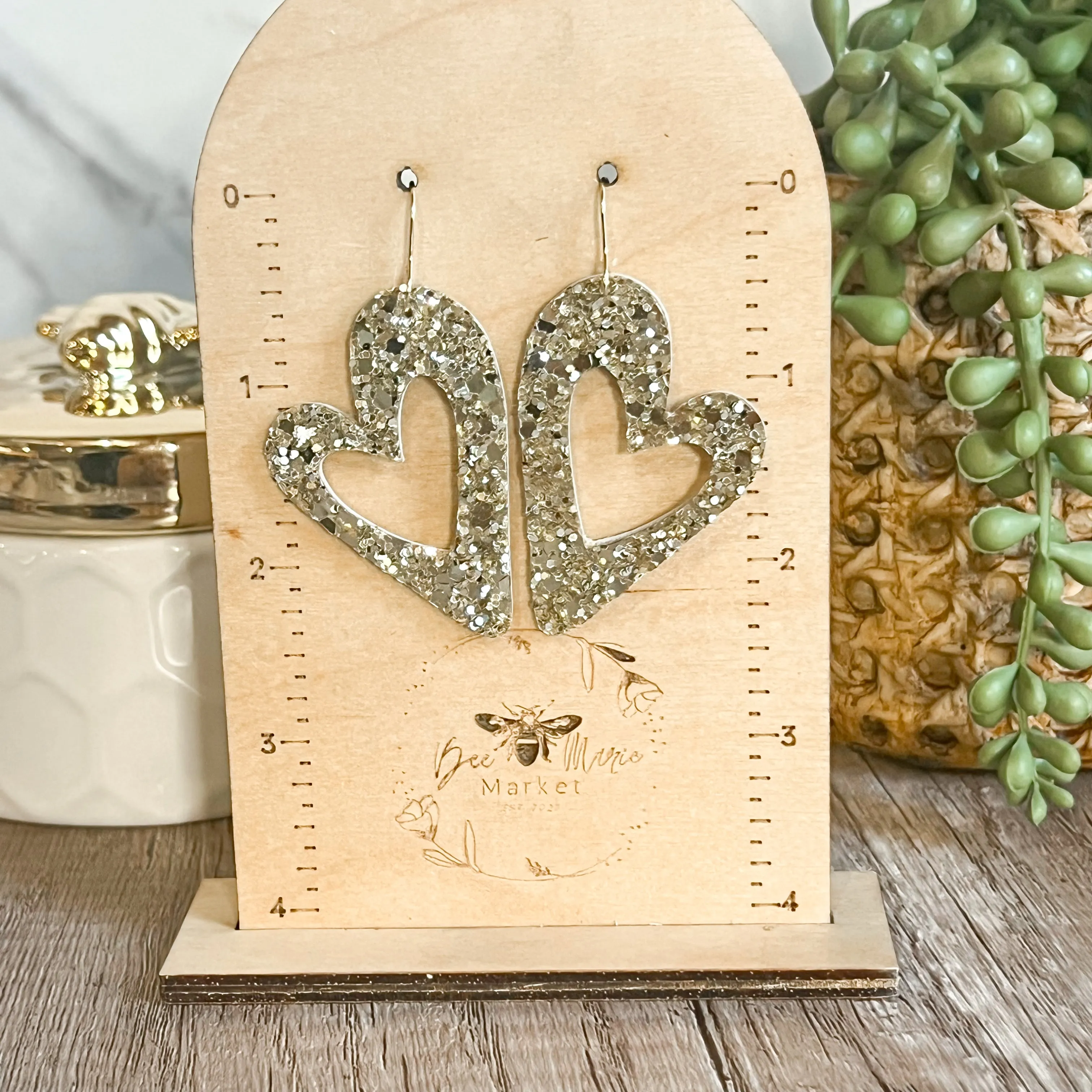 Holly Gold Glitter Open Heart Earrings sold by Roxie’s Picks product image thumbnail 4