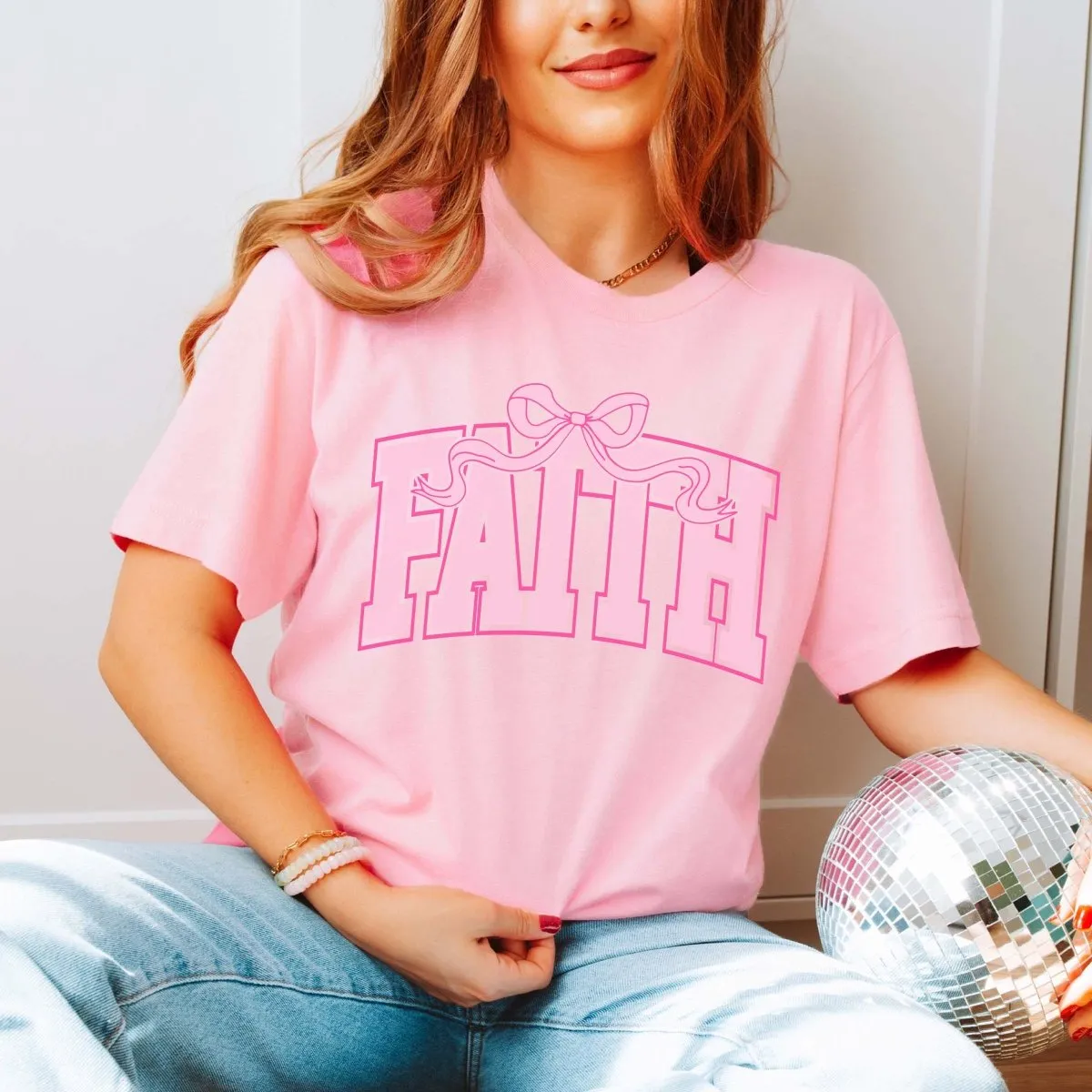 Faith Pink Bow Bella Graphic Tee sold by Roxie’s Picks