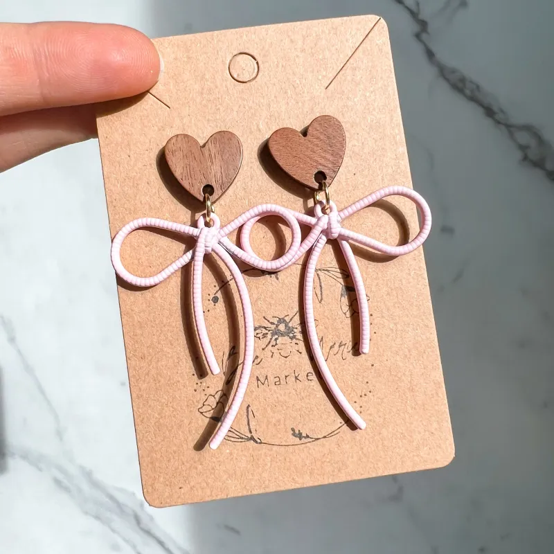 Cindy Pink Bow Heart Earrings sold by Roxie’s Picks