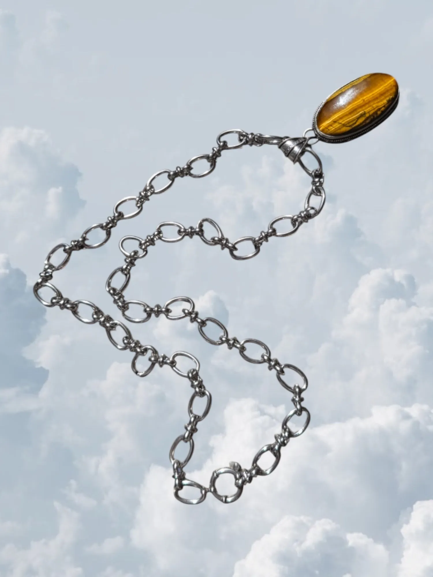 Tiger Eye Silver sold by Zandria