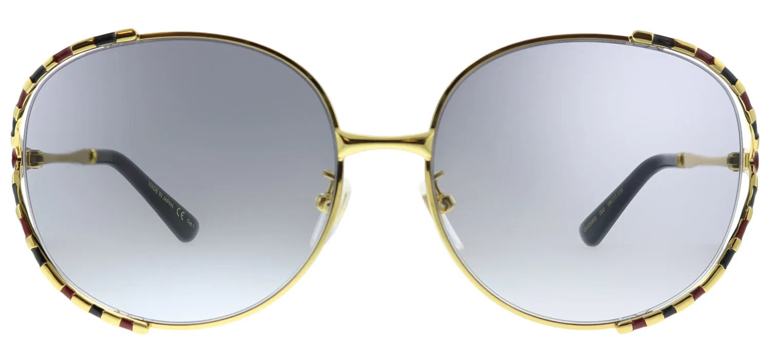 Gucci GG 0595S 002 Round Metal Gold Sunglasses with Grey Gradient Lens sold by Gaffos