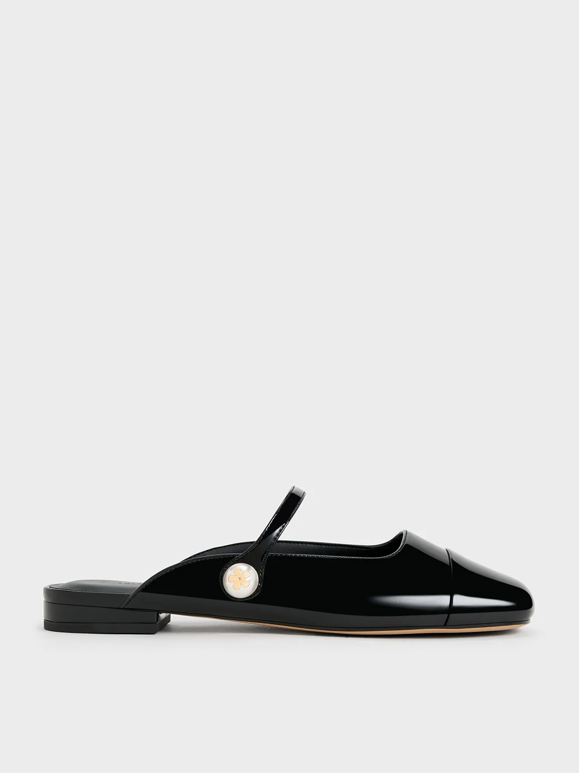 Charles & Keith - Aeryn Patent Pearl Embellished Flat Mules sold by Charles & Keith