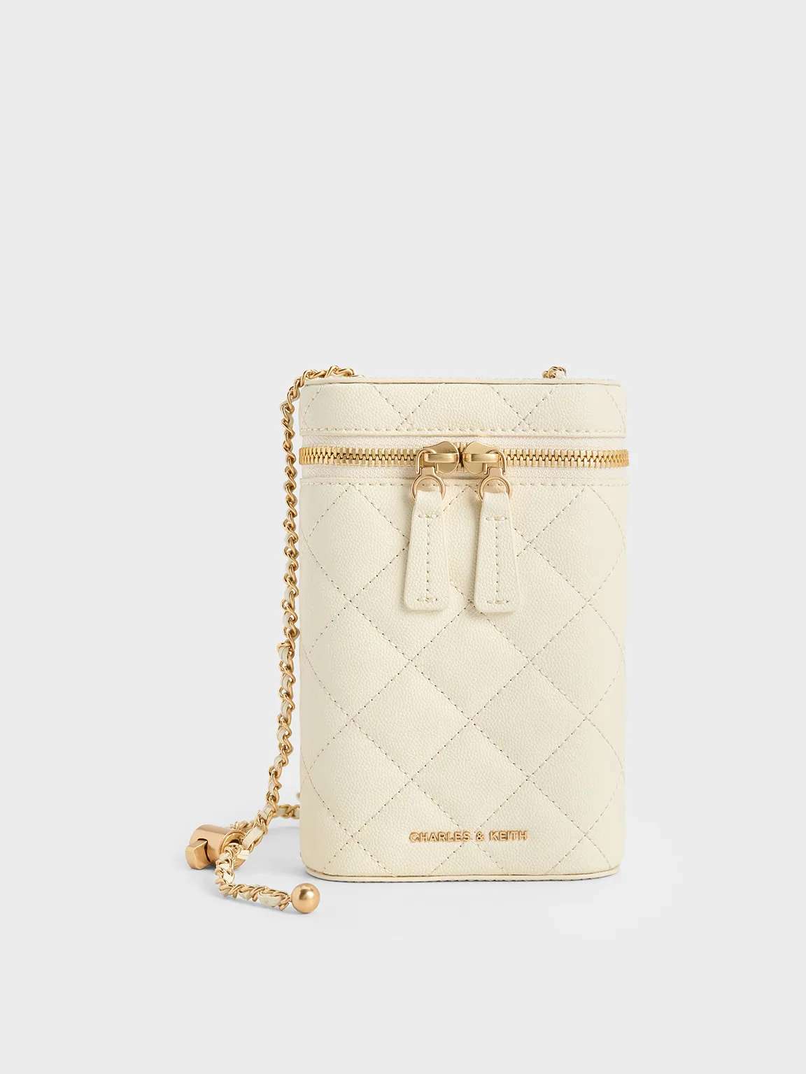 Charles & Keith - Mini Apfra Quilted Elongated Bag sold by Charles & Keith