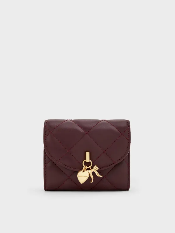 Charles & Keith - Arrietty Quilted Bow-Heart Charm Curved-Flap Wallet sold by Charles & Keith