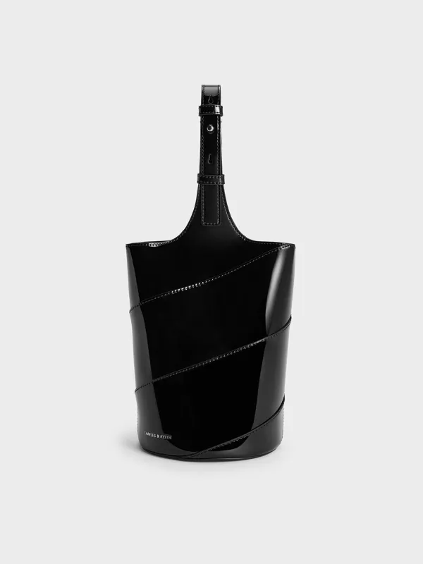 Charles & Keith - Trin Patent Cylindrical Bucket Bag sold by Charles & Keith